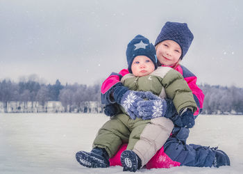 Full length of father and son during winter