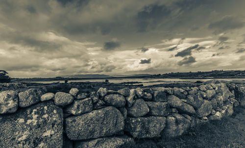 Scenic view of rocks on land against sky