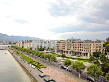 View of buildings in city against cloudy sky