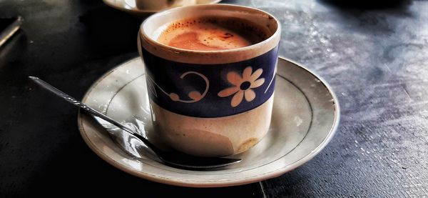 High angle view of coffee cup on table