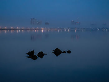 Scenic view of sea against sky at night