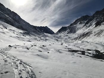 Scenic view of snowcapped mountains against sky