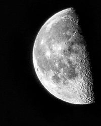 Low angle view of moon against sky at night