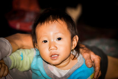 Close-up portrait of girl at home