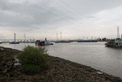 Boats in sea against sky