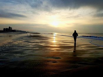 Silhouette of woman on beach