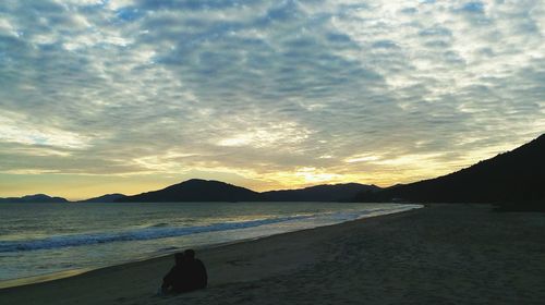 Scenic view of sea against dramatic sky