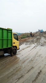 Truck on road against clear sky