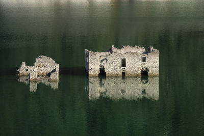 The remains of an ancient house emerged from a lake