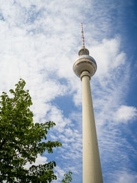 Low angle view of communications tower against sky