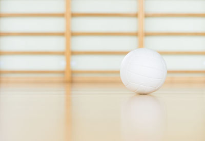 Close-up of white ball on table