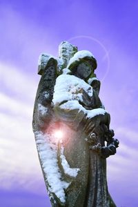 Low angle view of statue against sky