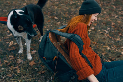 Midsection of woman on field during autumn
