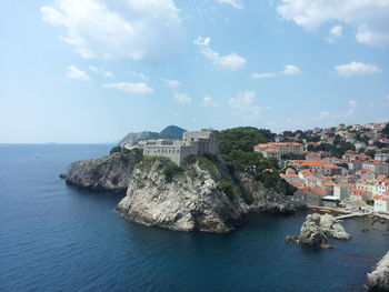 View of sea with buildings in background