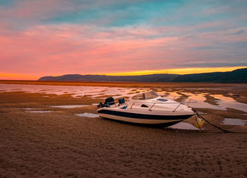 Scenic view of beach against sky during sunset