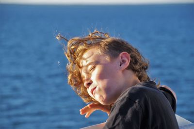 Portrait of boy against sea