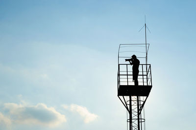 Low angle view of street light against sky