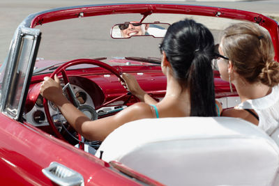 Rear view of people sitting in car