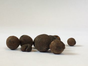 Close-up of fruits against white background