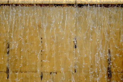 Full frame shot of ice cream hanging against wall