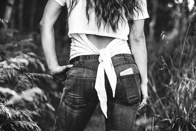 Low section of woman standing outdoors