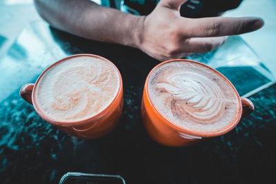 Close-up of hand holding coffee