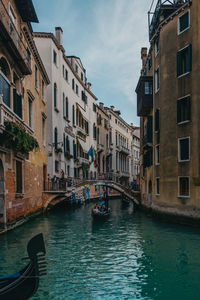 Canal passing through city buildings