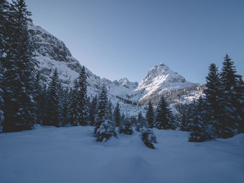 Scenic view of snow covered mountain against clear sky