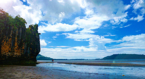 View of calm sea against cloudy sky