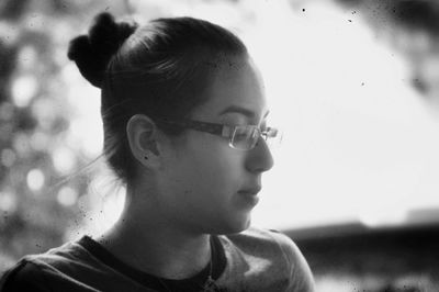 Close-up of young woman looking away