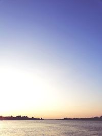 Scenic view of sea against clear sky during sunset