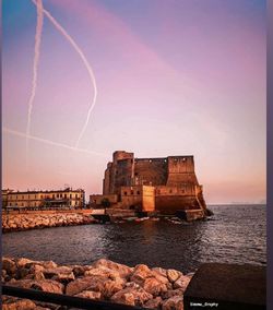 Scenic view of sea against sky at dusk