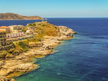 Scenic view of sea against clear blue sky