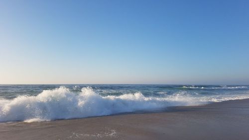 Scenic view of sea against clear sky