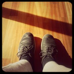 Low section of person wearing shoes