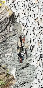 Full length of man on rock against wall