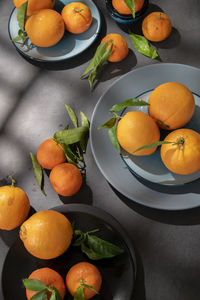 Fresh raw citrus fruits on dark background, healthy food ingredients