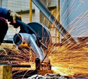 Cropped image of man working in factory