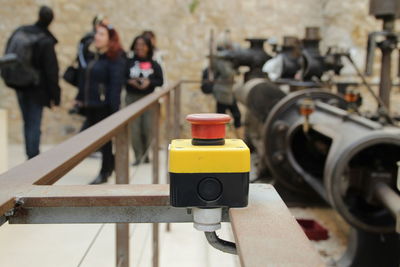 Machinery with people standing in background