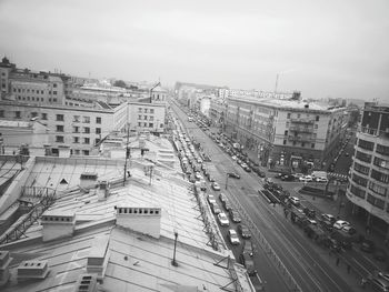 High angle view of city street and buildings against sky