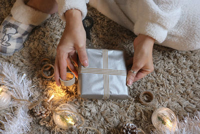 Midsection of woman holding christmas decorations