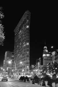 Low angle view of illuminated buildings at night