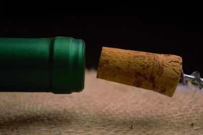 Close-up of beer bottles on table