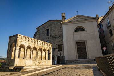 Exterior of historic building against clear blue sky