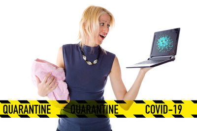 Woman using smart phone against white background