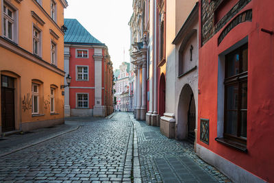 Footpath amidst buildings in town