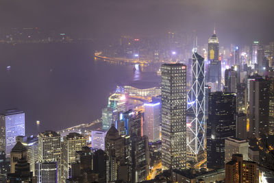 Illuminated modern buildings in city at night