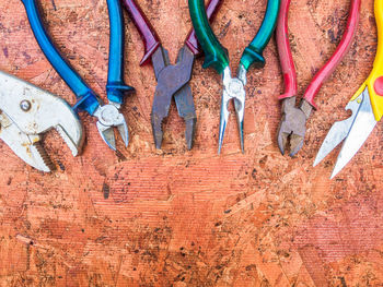 Directly above shot of various pliers on table