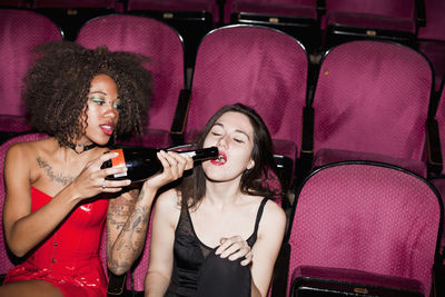 Friends hanging out in a theater