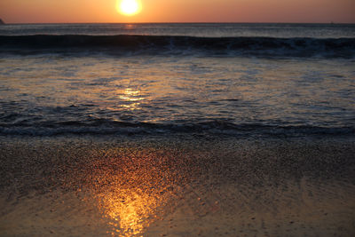 Scenic view of sea against sky at sunset